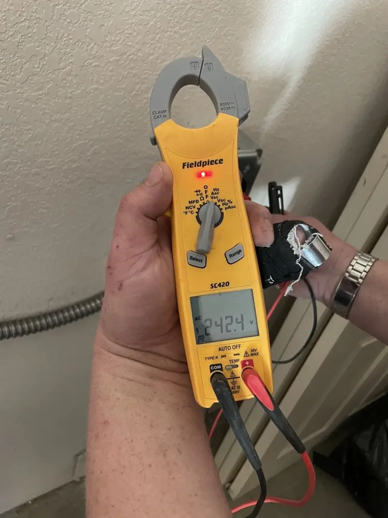 Voltage testing with clamp meter during Electrical Installation Services in Midway North